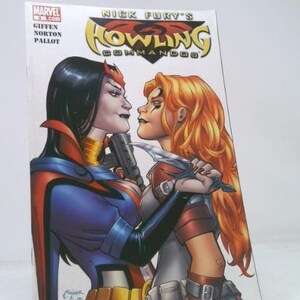 May include: Comic book cover for Nick Fury's Howling Commandos. The cover art features two women facing each other, one with black hair and the other with red hair. The woman with black hair is holding a gun, and the other is holding a knife.