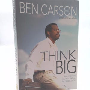 May include: A hardcover book titled "Think Big" by Ben Carson, M.D., with Cecil Murphey. The cover features a photo of Ben Carson and the words "Think Big" in large, bold letters. The book's spine also displays the author's name and the title.