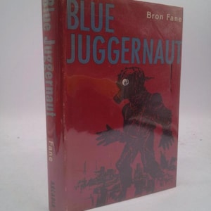 May include: A vintage book titled "Blue Juggernaut" by Bron Fane. The cover is a deep red with blue lettering and a silhouetted figure. The book's spine also features the title and author.