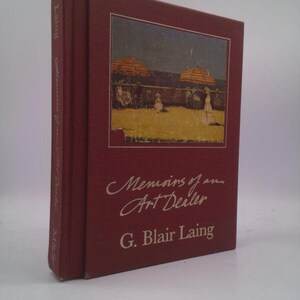 May include: A maroon hardcover book titled "Memoirs of an Art Dealer" by G. Blair Laing. The cover features a painting of people under striped umbrellas on a beach. The book's spine also has text.