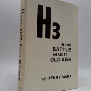May include: A hardcover book titled "H3 In The Battle Against Old Age" by Henry Marx. The cover is off-white with large black text. The spine also has the title in black.