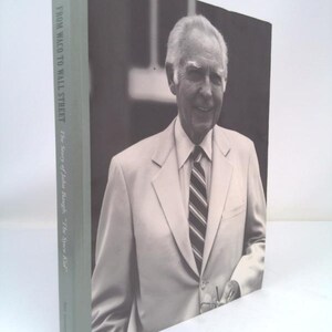 May include: A black and white photo of a man in a suit jacket and tie. The book cover reads "From Waco to Wall Street: The Story of Jobs Baugh, "The Synww Kid."