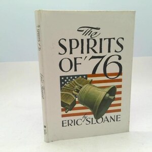 May include: A hardcover book titled "The Spirits of '76" by Eric Sloane. The cover features a depiction of the Liberty Bell superimposed over a stylized American flag. The book's title is in a bold, black font.