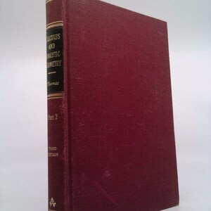 May include: A maroon-colored book titled "Calculus and Analytic Geometry" by Thomas. The spine features gold lettering and the text "Part 2" and "Third Edition". The book is published by Addison Wesley.