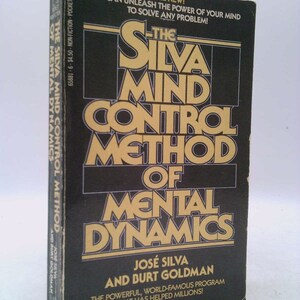 May include: A black and gold book cover with the title "The Silva Mind Control Method of Mental Dynamics" by José Silva and Burt Goldman. The cover text reads "All New! You can unleash the power of your mind to solve any problem!"