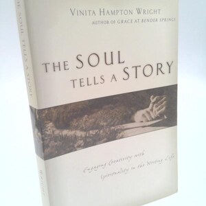 May include: A hardcover book titled "THE SOUL TELLS A STORY" by Vinita Hampton Wright. The book cover is off-white with the title in large, dark letters. The cover also features a sepia-toned image and the text "Engaging Creativity with Spirituality in the Writing Life."