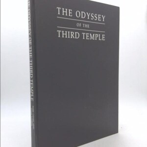 May include: A dark gray hardcover book with the title "The Odyssey of the Third Temple" printed in white on the front cover.