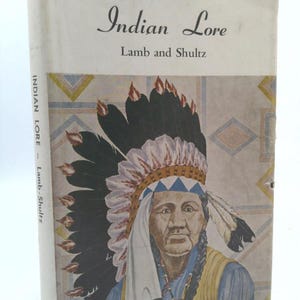 May include: Vintage book titled "Indian Lore" by Lamb and Shultz. The cover features an illustration of a Native American man wearing a feathered headdress. The book's spine displays the title and authors.