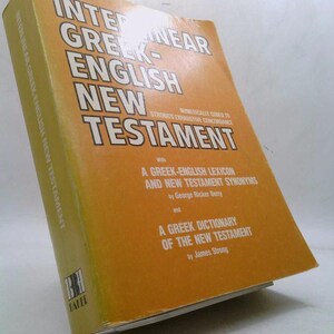 May include: A yellow book titled "Interlinear Greek-English New Testament" with the text "Numerically Coded to Strong's Exhaustive Concordance" on the cover. The book includes a Greek-English Lexicon and New Testament Synonyms by George Ricker Berry and a Greek Dictionary of the New Testament by James Strong.