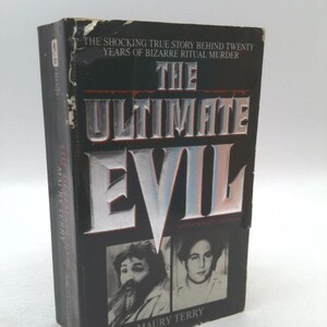 May include: A hardcover book titled "The Ultimate Evil" with a black cover and silver lettering. The book features two black and white portraits and the author's name, Maury Terry. The cover also includes the text: "The shocking true story behind twenty years of bizarre ritual murder."