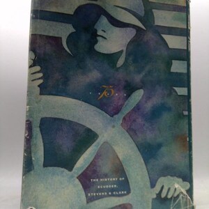 May include: Vintage book cover with a watercolor illustration of a person at a ship's wheel. The cover is primarily blue and purple, with the text "THE HISTORY OF SCUDDER, STEVENS & CLARK" and the number "75" visible.