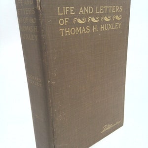 May include: A brown book with gold lettering on the cover. The title is "Life and Letters of Thomas H. Huxley".