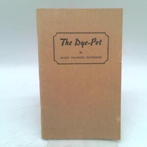 May include: A vintage book titled "The Dye-Pot" by Mary Frances Davidson. The book has a tan cover with the title and author's name in a dark font within a decorative frame. The book is standing upright.