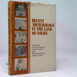 May include: A hardcover book titled "Recent Archaeology in the Land of Israel." The book has a beige cover with orange accents and several small images. The text on the cover includes the title and the names of the editors.