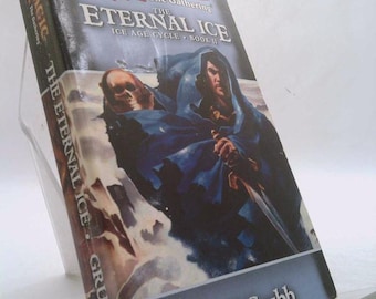 May include: A paperback book titled "Magic: The Gathering, The Eternal Ice, Ice Age Cycle, Book II" by Jeff Grubb. The cover art features a figure in a blue cloak with a sword, and a skull. The book is propped up on a clear plastic stand.