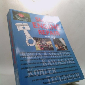 May include: A blue book titled "Small Engine Repair" with the text "Up to 20 HP." The cover features images of engine parts and machinery. The book's text describes engine repair procedures and maintenance.