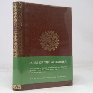 May include: A hardcover book titled "Tales of the Alhambra" with a brown cover and a green band. The book has gold accents on the spine and a decorative emblem on the front. The text on the cover includes the title and a description.
