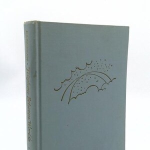 May include: A light blue hardcover book titled Telephone Between Worlds by Crenshaw, published by DeVorss & Co. The front cover features a gold-colored line drawing of a stylized bridge or archway with small dots representing stars or rain.