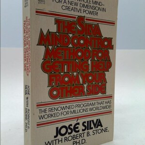 May include: A book titled "The Silva Mind Control Method for Getting Help From Your Other Side" by Jose Silva with Robert B. Stone, Ph.D. The book cover is beige with red and gold lettering. The book is a pocket book.