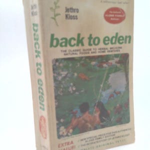 May include: A vintage book titled "Back to Eden" by Jethro Kloss. The cover features a green and white design with the title in large green letters. The book's cover also includes an illustration of a couple in a garden setting.