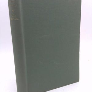 May include: A green hardcover book with the title "Living With Birds" and the author's name "L.H. Howar".