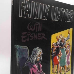 May include: A hardcover book titled "Family Matter" by Will Eisner. The cover is black with white lettering. The illustration depicts a group of people in a doorway and a seated figure with long white hair.
