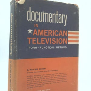 May include: A vintage book titled "Documentary in American Television" with a navy blue and orange cover. The title is in white, with a star and stripes design. The book's spine also displays the title.