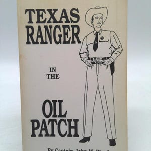 May include: A book cover with a black and white illustration of a Texas Ranger wearing a cowboy hat and a badge. The title of the book is "Texas Ranger in the Oil Patch" by Captain John M. Wood.