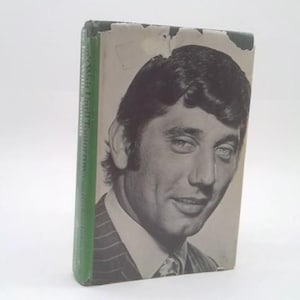 May include: Vintage hardcover book with a black and white portrait of a man on the cover. The book has a green spine and shows signs of wear. The man is wearing a suit and tie.