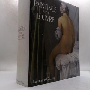 May include: A hardcover book titled "Paintings in the Louvre" by Lawrence Gowing. The book's cover features a nude figure with a painted face. The spine displays the title in a vertical format. The book is set against a white background.
