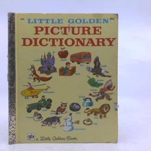 May include: A vintage "Little Golden Picture Dictionary" book with a yellow cover. The cover features colorful illustrations of various objects and animals, including a fox, apple, and eagle. The book's title is in large red letters.