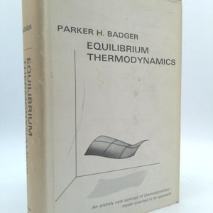 May include: A hardcover book titled "EQUILIBRIUM THERMODYNAMICS" by Parker H. Badger. The cover is off-white with black text and a diagram. The book's spine also displays the title. The bottom of the cover reads "An entirely new concept of thermodynamics - model oriented in its approach."