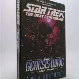 May include: A black paperback book with a galaxy background and the title "Star Trek: The Next Generation The Genesis Wave Book Three" by John Vornholt.