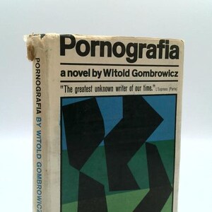 May include: A vintage paperback book titled "Pornografia" by Witold Gombrowicz. The cover features an abstract design in black, green, and blue. The book's title and author's name are in bold black font. The spine reads "Pornografia by Witold Gombrowicz".
