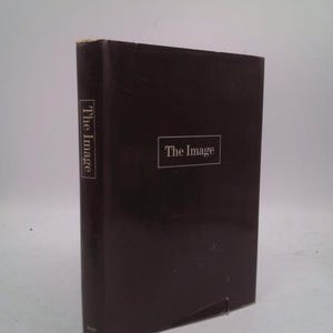 May include: A hardcover book with a dark brown cover. The title "The Image" is printed in white on the front and spine. The book is standing upright against a white background.
