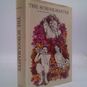 May include: A vintage hardcover book titled "The Schoolmaster" by Earl Lovelace. The cover features illustrations of people and flowers in shades of pink, orange, and brown. The book's spine displays the title vertically.