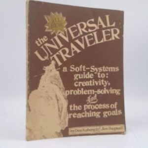 May include: A vintage book titled "The Universal Traveler" with a brown cover. The title is in large, stylized white letters. The book's subtitle is "a Soft-Systems guide to: creativity, problem-solving and the process of reaching goals."