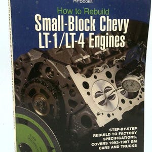 May include: A book titled "How to Rebuild Small-Block Chevy LT-1/LT-4 Engines" by Mike Mavrigian. The cover features a detailed image of an engine, with text indicating step-by-step instructions for rebuilding to factory specifications for 1992-1997 GM cars and trucks.