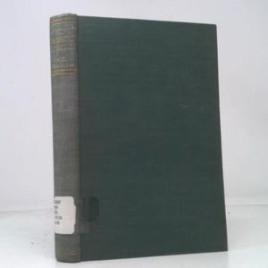 May include: A hardcover book with a dark green cover and a gray spine. The spine has gold lettering and a white label. The book is standing upright against a white background.