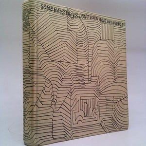 May include: A beige book with black lines and the title "Some Haystacks Don't Even Have Any Needles" on the cover.