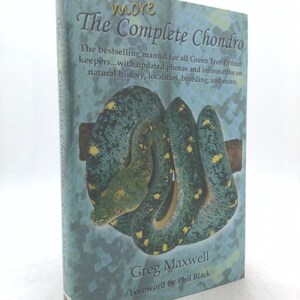 May include: A hardcover book titled "The Complete Chondro" with a green and blue cover featuring a coiled green tree python. The book's cover includes text about the manual for Green Tree Python keepers, written by Greg Maxwell.