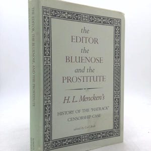 May include: A vintage book titled "The Editor, The Bluenose, and the Prostitute" by H.L. Mencken. The book has a light green cover with the title in brown text. The book is a history of the "Hatrack" censorship case.