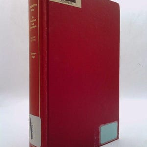 May include: A red hardcover book with the title "Cognitive War" and the author "Thomas C.  Wight" on the spine. The book is a second edition and has a barcode sticker on the front cover.
