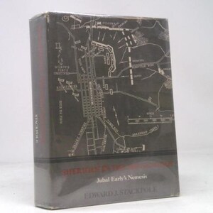 May include: A hardcover book titled "Sherman's Campaign" by Edward J. Stackpole. The book has a dark gray cover with a detailed map illustration. The title and author's name are printed in white.