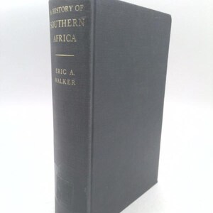 May include: A black hardcover book titled "A History of Southern Africa" by Eric A. Walker. The book is published by Longmans.