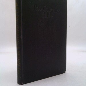 May include: A black hardcover book titled "The Century Bible" with embossed text and a decorative emblem. The spine reads "Minor Prophets". The book is in good condition.
