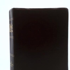 May include: A dark brown hardcover book with gold lettering on the spine and the name Rebecca D. Eschenbach embossed in gold on the front cover. The spine features horizontal gold lines and the title The Quiet Hour Bible.