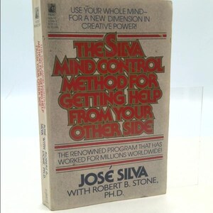 May include: A brown book with the title "The Silva Mind Control Method for Getting Help From Your Other Side" in red and gold lettering. The book is by José Silva with Robert B. Stone, Ph.D. and has a white background.