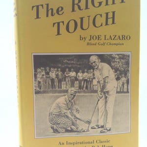 May include: A yellow book titled "The Right Touch" by Joe Lazaro, Blind Golf Champion. The cover features a black and white illustration of two men playing golf, with text "An Inspirational Classic, Introduction by Bob Hope."