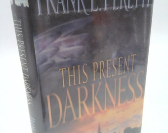 This Present Darkness by Frank E. Peretti